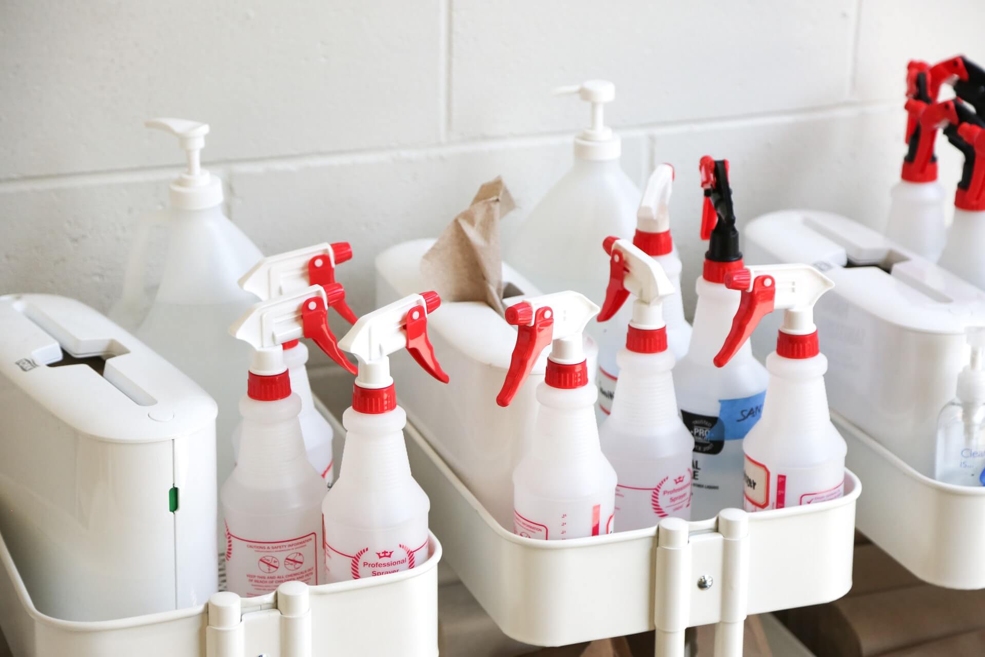 Cleaning caddy filled with spray bottles